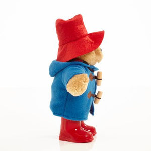 As a standing 25cm plush character, the Classic Paddington with Boots is an iconic addition to any Paddington Bear collection and is the perfect playroom pal to accompany story time for children aged 10 months and over. This striking soft and cuddly character toy features the distinctive and famous Paddington Bear accessories including a super soft lined duffle coat with real toggles, a battered red felt bush hat and 'real' shiny red wellington boots