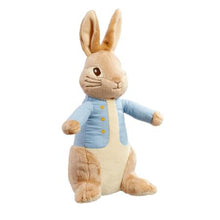 Load image into Gallery viewer, this adorable Peter Rabbit soft toy from milkandblack to ready to head out on adventures but he&#39;s also super soft, and loves a big squeezy cuddle! Beatrix Potter&#39;s Peter Rabbit, is one of the most-loved children&#39;s characters, and this 24cm lovable bunny, with his famous blue jacket and big floppy ears, makes a wonderful playtime friend as well as super soft and cuddly night time companion.  This special cuddly friend, that is suitable from birth, will be by your little one&#39;s side throughout their childhood.