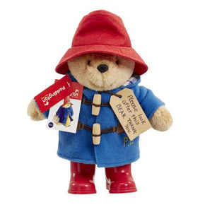 As a standing 25cm plush character, the Classic Paddington with Boots is an iconic addition to any Paddington Bear collection and is the perfect playroom pal to accompany story time for children aged 10 months and over. This striking soft and cuddly character toy features the distinctive and famous Paddington Bear accessories including a super soft lined duffle coat with real toggles, a battered red felt bush hat and 'real' shiny red wellington boots